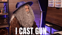 a man with a wizard hat and beard says i cast gun