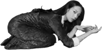 a black and white photo of a woman in a dress