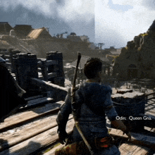 a man in a video game named odin is standing on a wooden ledge