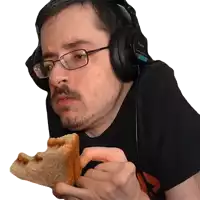 a man wearing headphones is eating a sandwich with peanut butter