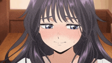 a close up of a girl 's face with purple hair and blue eyes