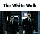 two men in suits and ties are walking down a street with the words the white walk below them