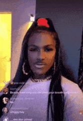 a woman with long hair and a ponytail has a beard