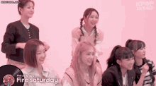 a group of girls are sitting in front of a pink background and the words fire saturday are on a record