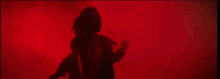 a close up of a person 's arm with a dark background