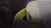 a close up of a person 's head with a helmet on it .