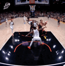 a basketball game is being played in front of a crowd and a burger king logo