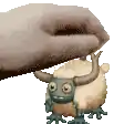 a cartoon character with horns is being held by a person .