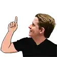 a man in a black shirt is pointing his finger up .