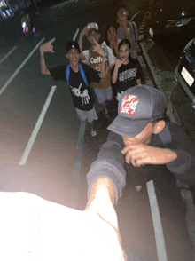 a group of young people are posing for a picture with one wearing a shirt that says coffin