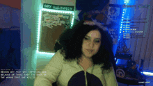 a happy halloween sign hangs above a woman 's head