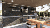 a kitchen with a table and chairs and a tv on the wall