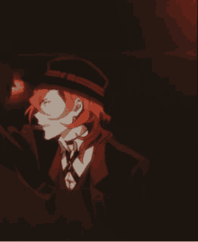 a man with red hair is wearing a hat