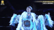 a woman in a feathered outfit stands in front of a sign that says project 9
