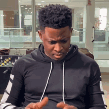 Confused Seyi Awolowo GIF - Confused Seyi Awolowo Looking At Hands GIFs