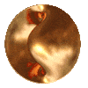 a close up of a copper ball on a white background that looks like a yin yang symbol .
