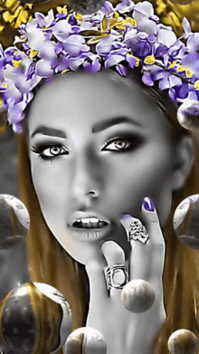 a woman with purple flowers on her head is wearing a silver ring
