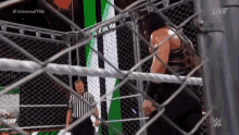 Roman Reigns Brock Lesnar GIF - Roman Reigns Brock Lesnar Chair GIFs