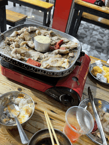 a cooking stove with a burner that says green flame on it