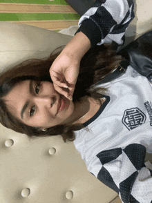 a woman wearing a shirt that says underground