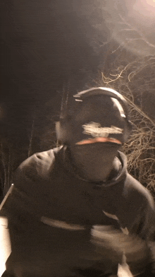 a blurry picture of a person wearing headphones and a mask