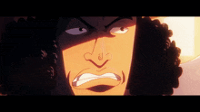 a close up of a man 's face with a very angry expression