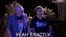 two men are standing next to each other and one of them is wearing a shirt that says babagan 's haunted museum