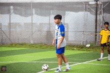 a soccer player wearing a jersey that says zen stands on the field