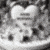 a blurred image of a heart with the word equals in the middle