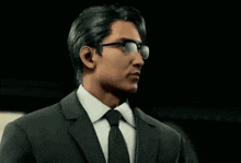 a man in a suit and tie wearing sunglasses