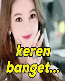a woman with her hand on her face and the words keren banget