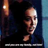 a woman in a black jacket says " and you are my family not him "