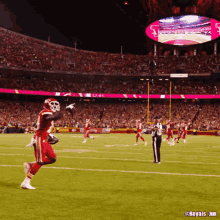 a football game is being played in a stadium with a large screen that says royals_jim