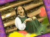 a picture of a girl with sbt written on the bottom