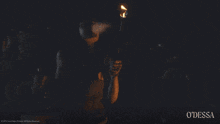 a woman holding a torch with the word odessa on the bottom left