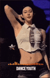a woman in a white crop top and black shorts is dancing with the words dance youth below her
