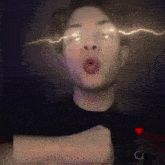 a man is making a funny face with lightning coming out of his eyes