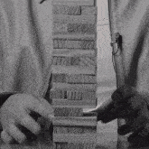 a person playing a game of jenga with a jacket that says escape dreams