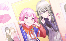 a girl with pink hair is smiling next to another girl