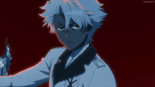 a man with white hair is standing in front of a red background with animelist.tv written on the bottom