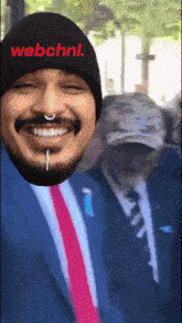 a man wearing a black beanie with webchnl on it