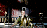 a man in a toga says " first i 'll stand on the battlefield and let their gaze fall upon me . "