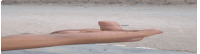 a close up of a person 's hand pointing to the side