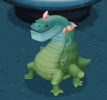a green dinosaur with pink flowers on its head is standing on a blue surface