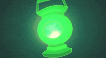 a green lantern is glowing in the dark and has a handle .