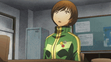 a girl wearing a green and yellow jacket has a smiley face pin on her chest