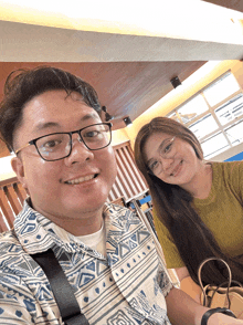 a man and a woman are posing for a picture together