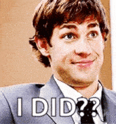 a man in a suit and tie is making a funny face and says `` i did '' .