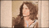 a pixelated image of a man looking out a window with the website 4gifs.com visible