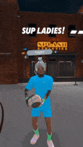 a person holding a basketball in front of a sign that says splash athletics